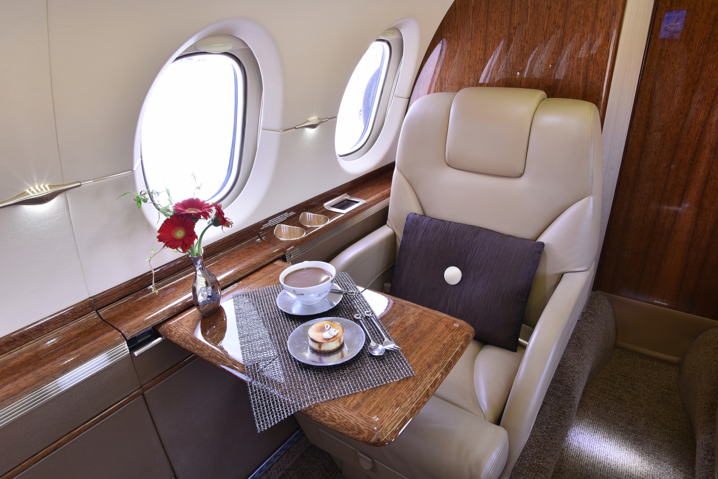 Luxurious seat with breakfast on the table with a coffee cup in the 2012 Hawker 900XP S/N HA-0209 jet on Freestream