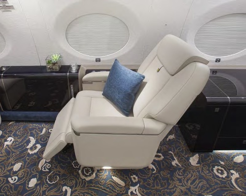 Reclining white comfy chair on jet